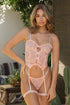 A woman wearing a peach lace corset set with ruffle trim and underwired cups, accompanied by a matching thong and garter belt.